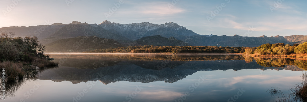 Mountains reflected in a lake in Corsica