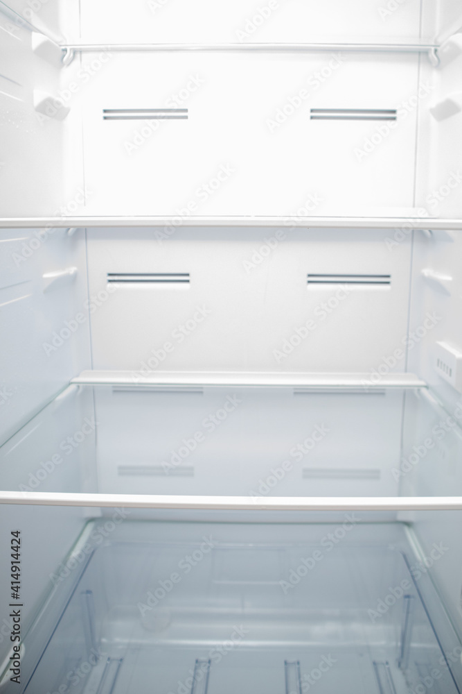 Empty Refrigerator inside. Empty fridge shelves.