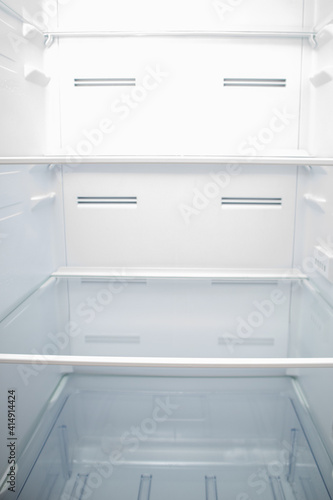 Empty Refrigerator inside. Empty fridge shelves.