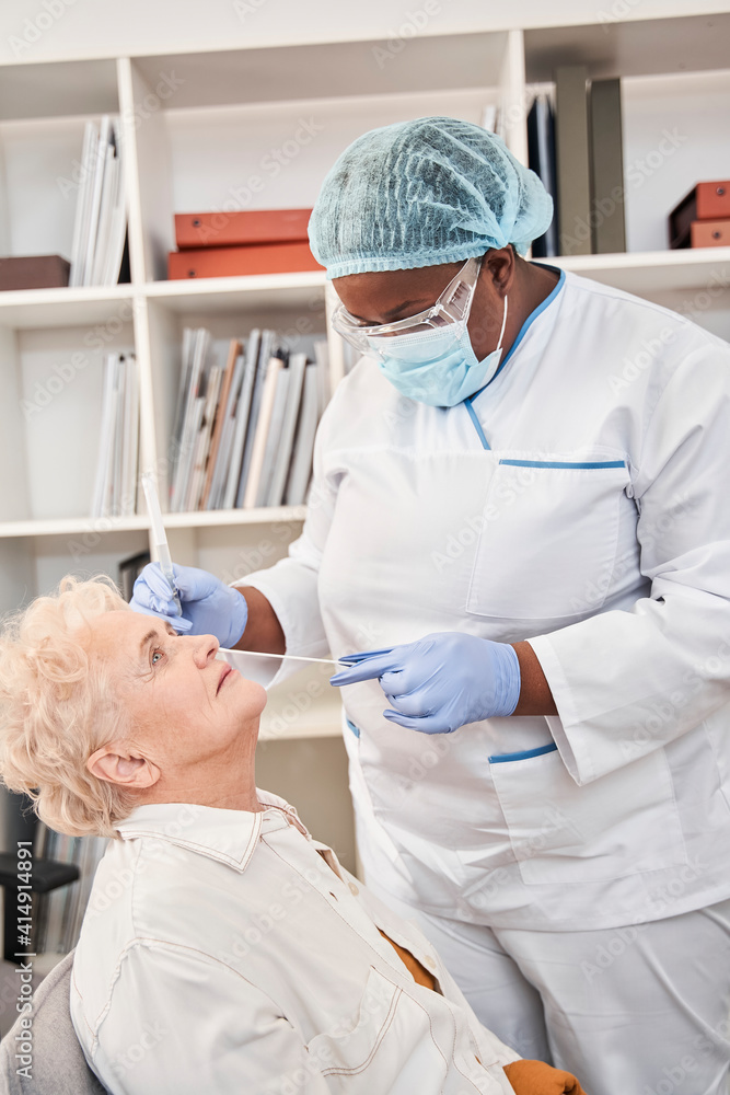 Nurse taking coronavirus or DNA test by nasal swab probe Nurse taking coronavirus or DNA test by nasal swab probe