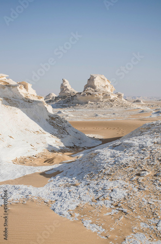 white desert with sand and lime stone rock formations. Bahariya national park Egypt. Surreal nature landscape. Scenic travel destinations africa