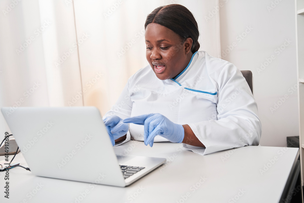Woman in medical form provides an online consultation Woman in medical form provides an online consultation