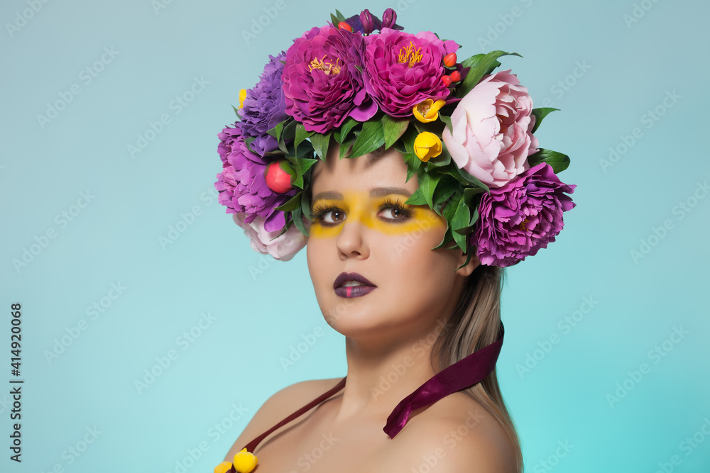 Fototapeta premium Beautiful brunette woman with flower wreath on her head.
