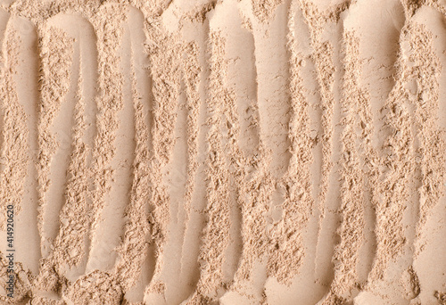 Homemade mineral face powder foundation or dry shampoo texture close up, selective focus. Make up background.