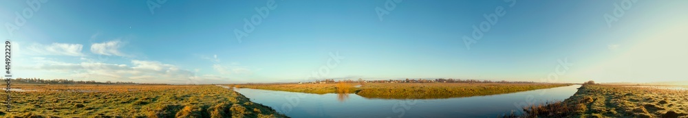 river overflow on a sunny cloudless day river overflow on a sunny cloudless day