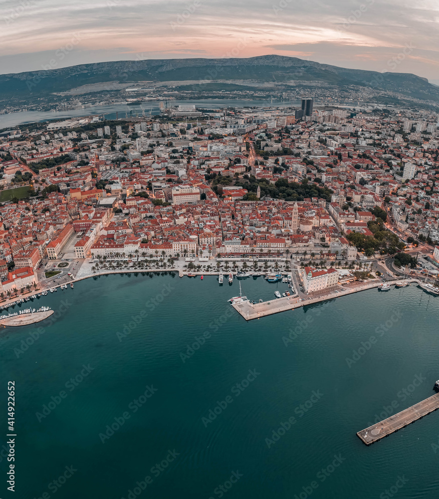 Aerial drone shot of Diocletian Palace in Split old town with lights before sunrise in Croatia
