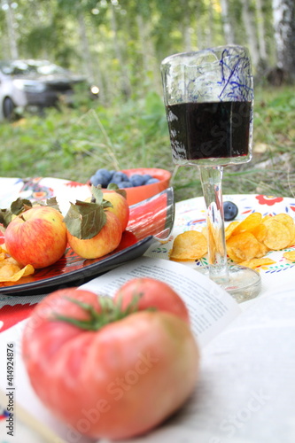 Autumn picnic with wine in the forest