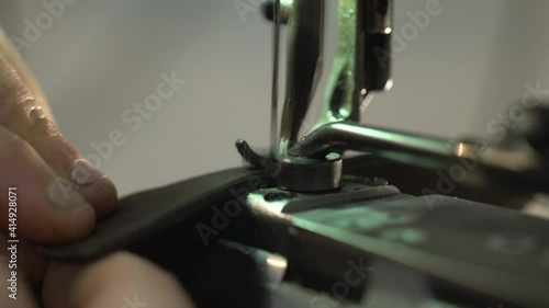 detail of leather processing sewing machine. macro shot