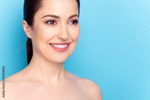 Cropped photo of young woman happy positive smile facial treatment lifting hydration cosmetology isolated over blue color background