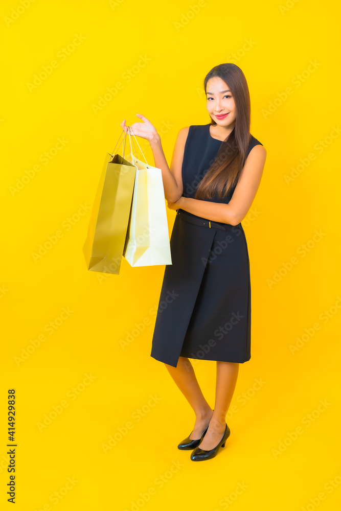 Portrait beautiful young asian business woman with a lot of shopping bag