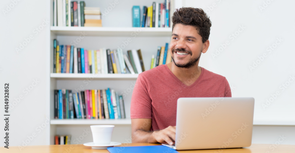 Latin american man with beard working at computer Latin american man with beard working at computer