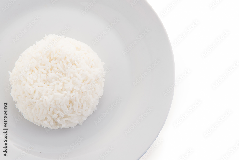 Close up cooked rice on plate isolated on white background. Close up cooked rice on plate isolated on white background.