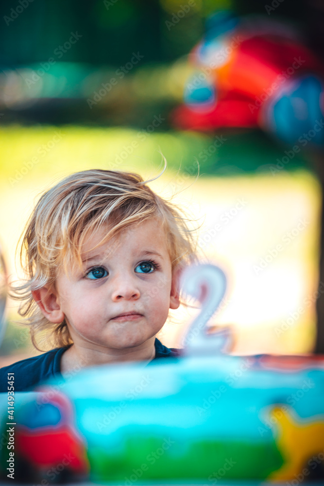 Fototapeta premium Little funny child celebrates his two years