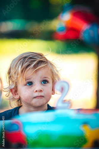 Little funny child celebrates his two years