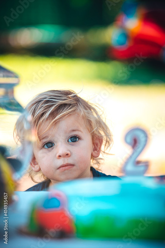 Little happy child celebrates his two years