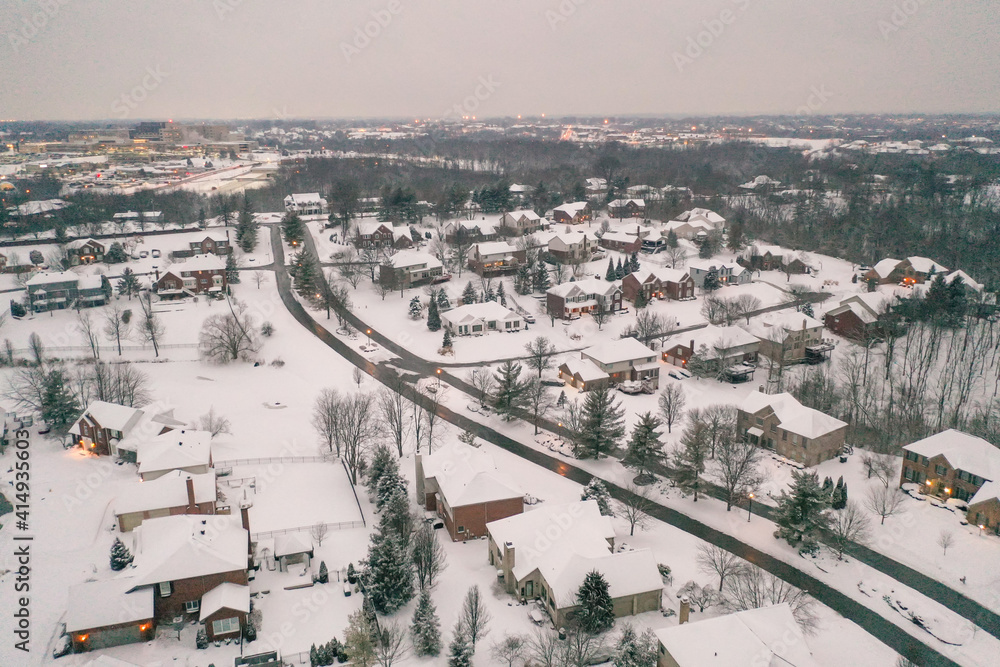 Winter snow storm across the United States covers midwest neighborhoods and homes