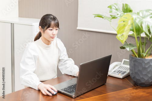 Woman working on a laptop PC