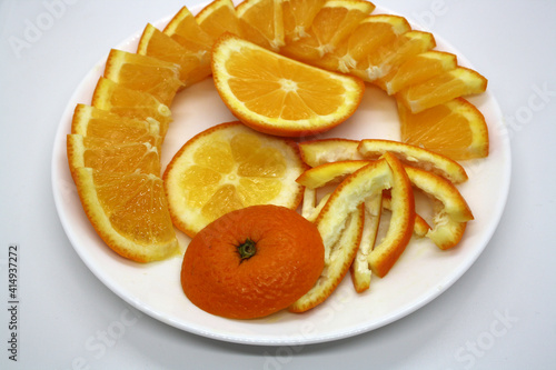 Fototapeta Naklejka Na Ścianę i Meble -  Juicy orange slices on a white background. Vitamin C.