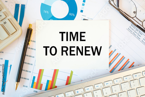 Time to renew is written in a document on the office desk, diagram and keyboard