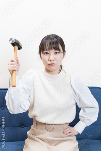 Woman wielding a hammer