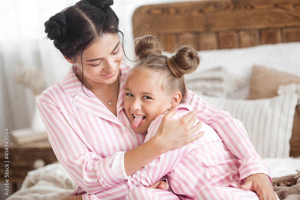 Mother and daughter having fun at home. Girls indoors. Mother and daughter having fun at home. Girls indoors.