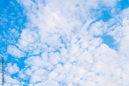  Beautiful white fluffy and cirrocumulus clouds on a blue sky background