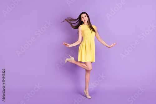 Full length body size view of pretty cheerful girl dancing having fun isolated over violet purple pastel color background