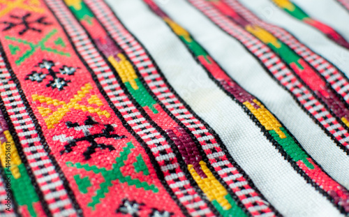 Colourful fancywork tablecloth, carpet. Background. Culture, etno. Embroidered good by cross-stitch pattern. Ukrainian ethnic ornament