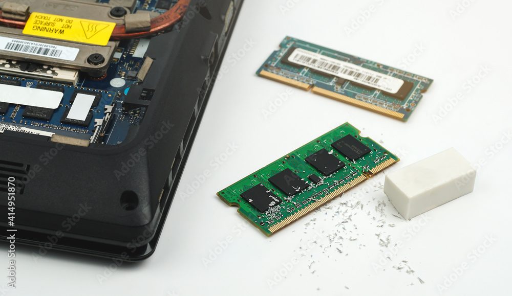 Workers in service centers clean dust at Random Access Memory or Electronic RAM board with eraser. Workers in service centers clean dust at Random Access Memory or Electronic RAM board with eraser.
