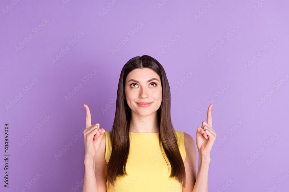 Portrait of attractive cheerful girl showing up copy space attention ad isolated over violet purple pastel color background Portrait of attractive cheerful girl showing up copy space attention ad isolated over violet purple pastel color background