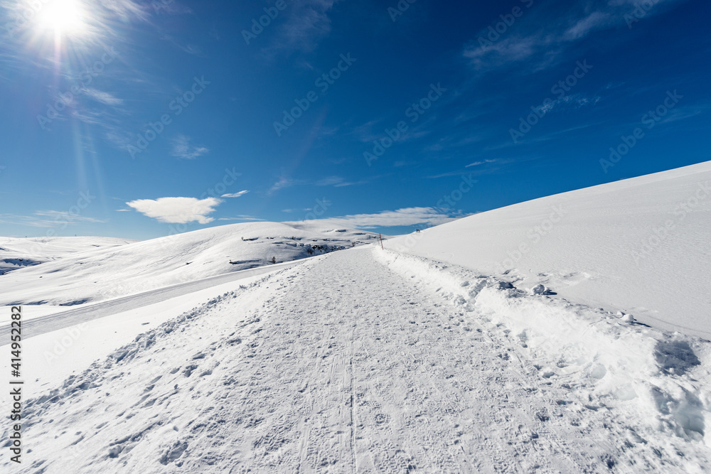 Cross-Country Skiing Tracks and footpath with snow in winter. Altopiano della Lessinia (Lessinia Plateau), Regional Natural Park, near Malga San Giorgio, ski resort in Verona province, Veneto, Italy, 