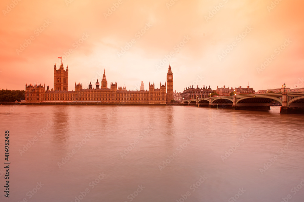Palace of Westminster at sunset, viewed from across the river Thames, London, UK