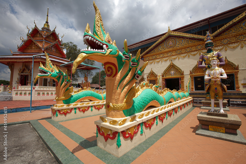 Guarding snakes at Wat Chayamangkalaram temple, Penang, Malaysia
