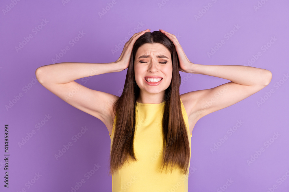 Fototapeta premium Portrait of attractive desperate girl suffering terrible news isolated over violet purple pastel color background