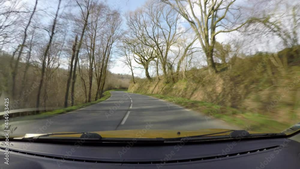 Point of view of car driving on country road in the French Basque Country, camera mounted inside the car on windscreen Point of view of car driving on country road in the French Basque Country, camera mounted inside the car on windscreen