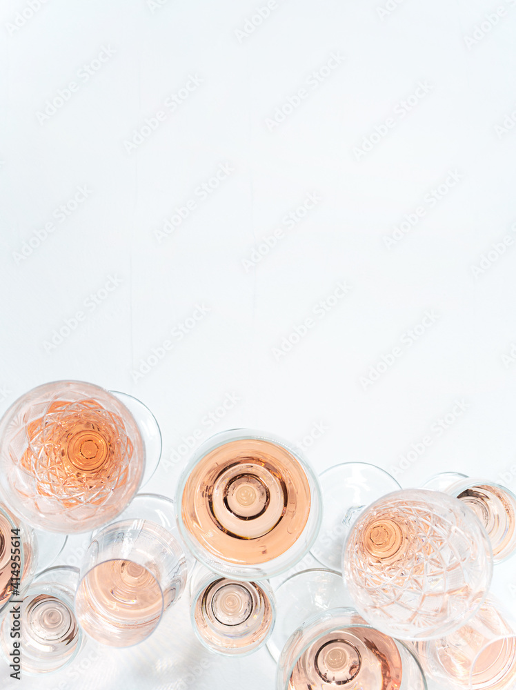 Sparkling rose wine in different glasses on white background with copy space Sparkling rose wine in different glasses on white background with copy space