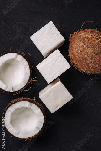 Coconut handmade soap and coco on dark concrete background