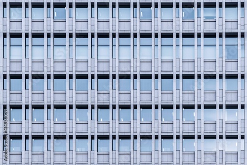 Windows on the tall buildings of the office building pattern and background seamless