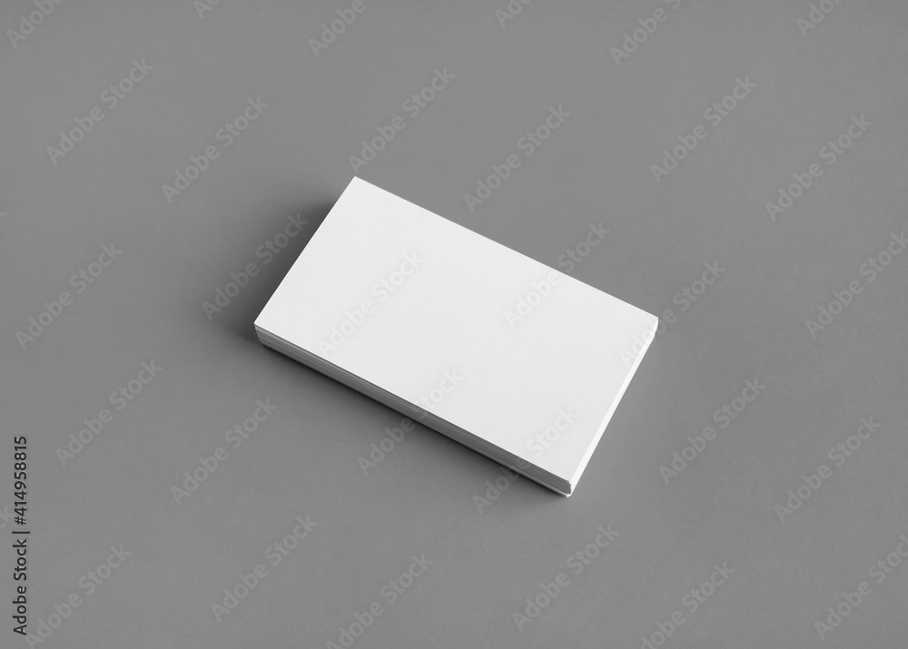 Photo of blank business card on gray paper background. Template for branding identity. Mockup for ID. Photo of blank business card on gray paper background. Template for branding identity. Mockup for ID.
