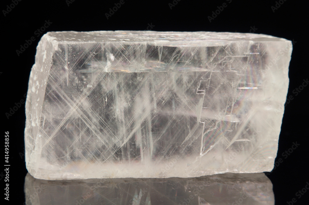 Macro mineral stone Iceland spar on black background Macro mineral stone Iceland spar on black background