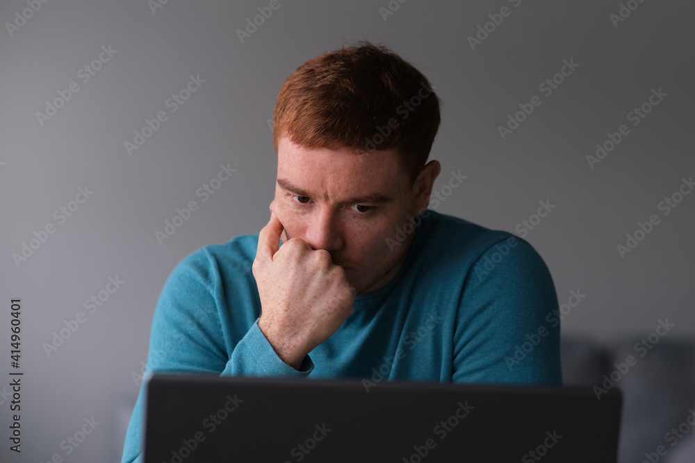 Frustrated stressed businessman at home office. businessman working on laptop computer holding head with hands looking down. Negative human emotion facial expression feelings. Frustrated stressed businessman at home office. businessman working on laptop computer holding head with hands looking down. Negative human emotion facial expression feelings.