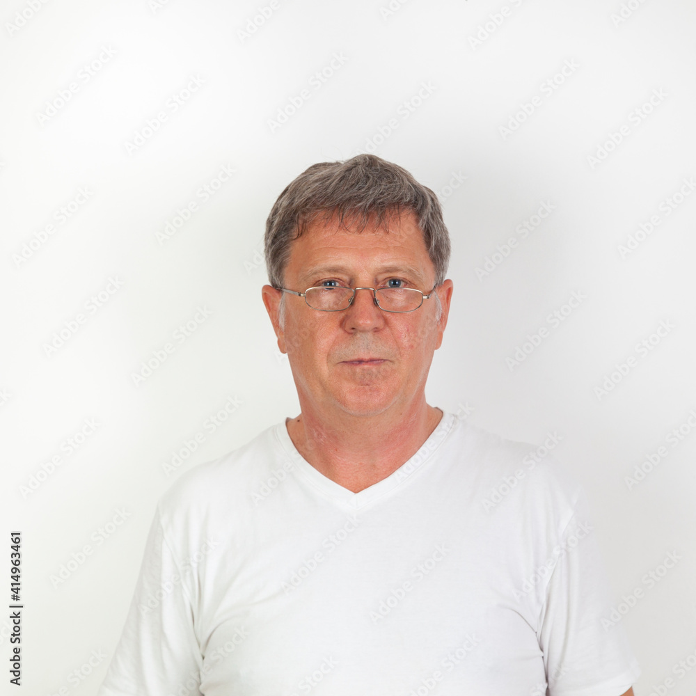 portrait of serious looking man with reading glasses, portrait of serious looking man with reading glasses,
