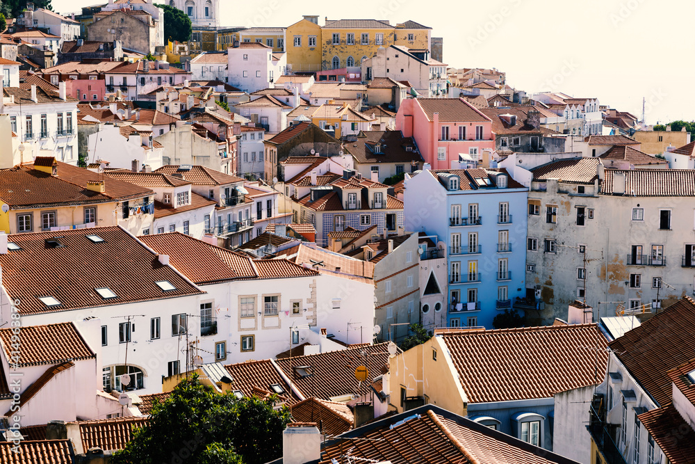A panoramic view over Lisbon with beautiful facades in summer sunlight.
