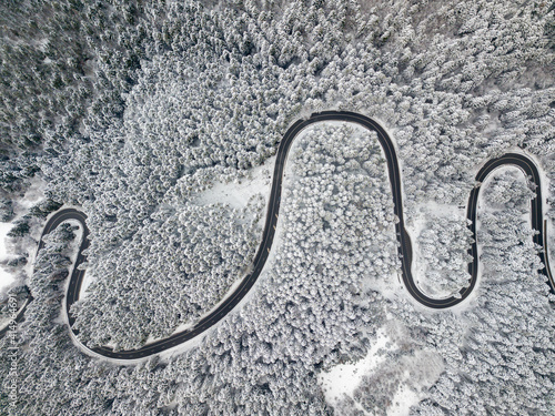Aerial view of a snow-covered forest road © Rafaila Gheorghita