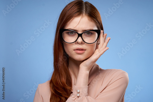 pretty woman with glasses holds hand falls down elegant style isolated background