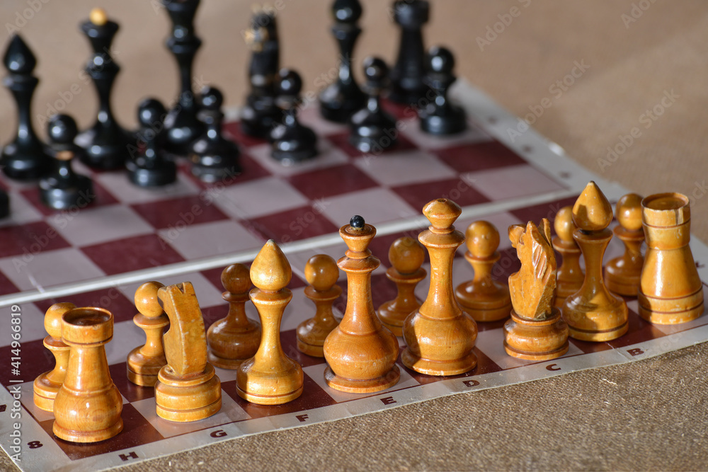 Chess pieces are standing on the board waiting for a new game. Chess pieces are standing on the board waiting for a new game.