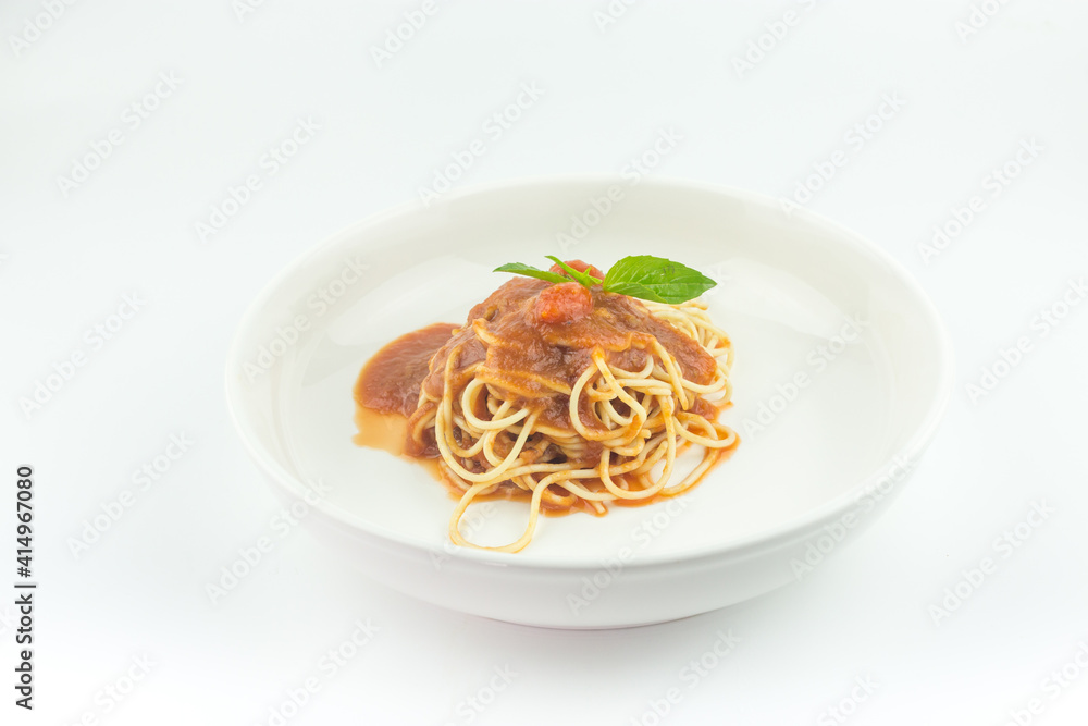 Spaghetti with tomato sauce in white plate on white background Spaghetti with tomato sauce in white plate on white background