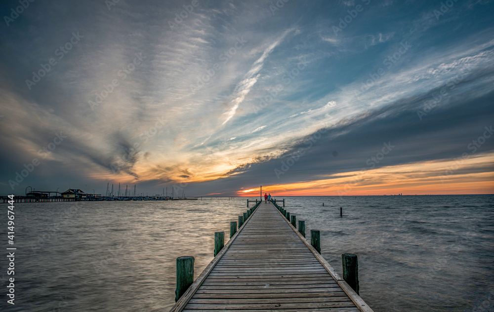 A Pier at Fairhope View during sunset