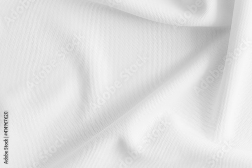 Rippled white cloth background. Fabric texture.