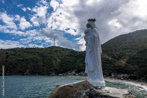 Virgen del Salitre on the rocks that overlook the sea in Chichiriviche de la Costa photo